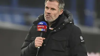 jamie carragher man city medals: Jamie Carragher speaking into a Sky Sports microphone