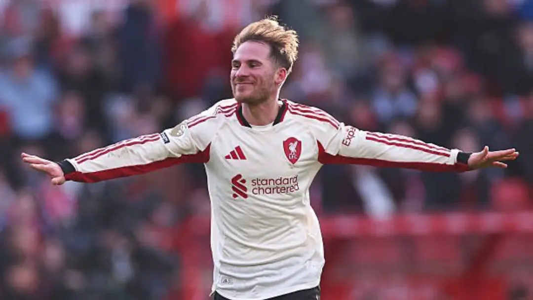 Alexis Mac Allister celebrating in a Liverpool FC kit